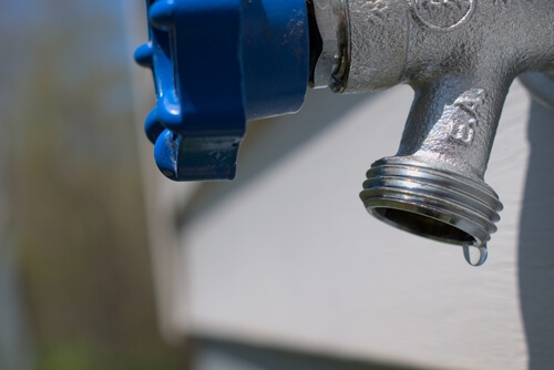 outdoor hose spigot dripping water requires plumbing spigot repair services